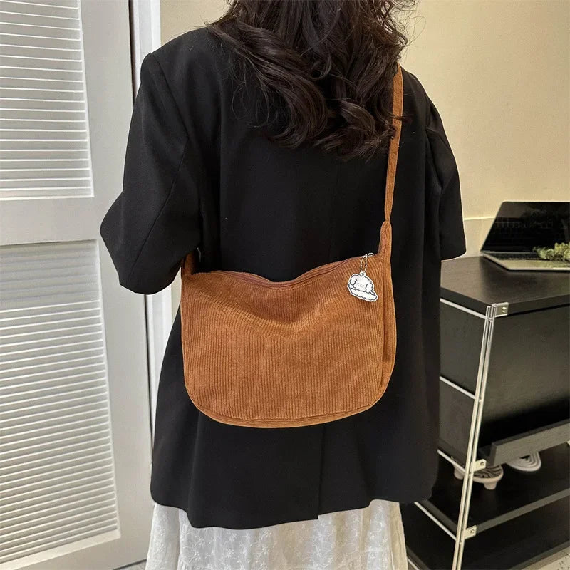 Sac d’épaule souple avec sangle longue et fermeture supérieure